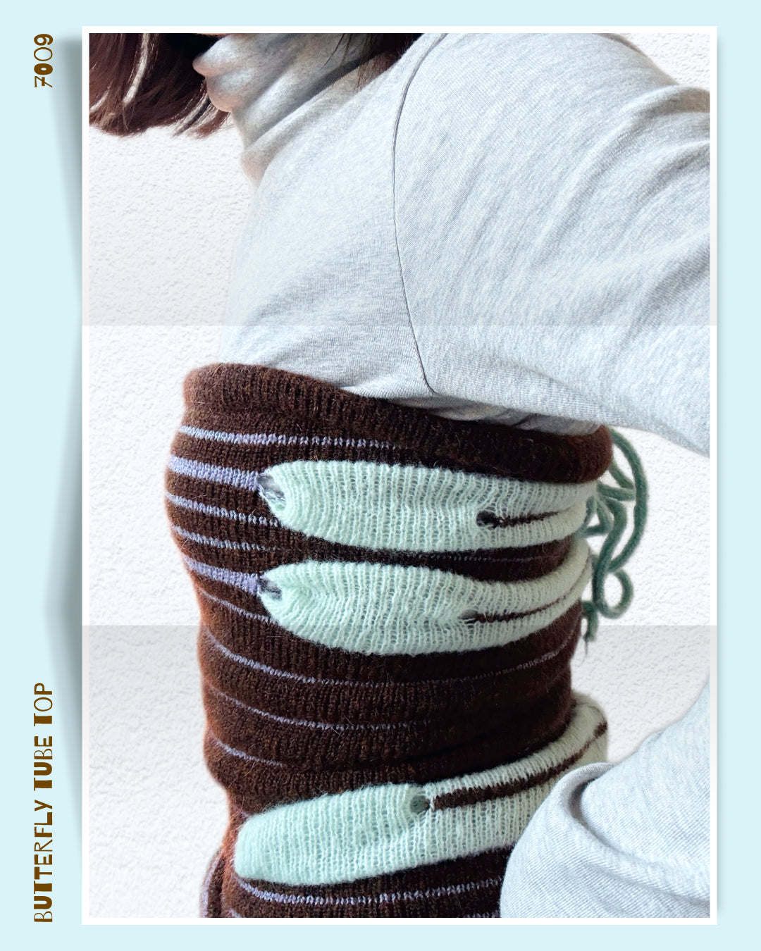 butterfly knit tube top worn on body, sculptural knit texture
close-up of striped knit tube top with butterfly shape design
side view of wool knit tube top with cut-out structure